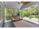 Charming screened-in porch with a ceiling fan, comfortable seating, and view of backyard at 2006 Keokuk Ct, Apex, NC 27523