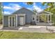 View of home's rear exterior featuring shed, grill and patio at 2006 Keokuk Ct, Apex, NC 27523
