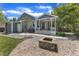 Backyard with covered patio and fire pit at 2006 Keokuk Ct, Apex, NC 27523