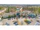 Overhead shot of the community clubhouse featuring an expansive parking lot with cars and a scenic landscape in the background at 208 Beckingham Loop, Cary, NC 27519