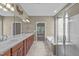 Bathroom boasts double sinks with a view of the soaking tub and separate shower at 208 Beckingham Loop, Cary, NC 27519