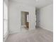 Inviting bedroom with neutral tones, plush carpeting, and a glimpse into a stylish en-suite bathroom, offering comfort and convenience at 208 Beckingham Loop, Cary, NC 27519