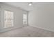 Bedroom with light carpeting and windows for natural light at 208 Beckingham Loop, Cary, NC 27519