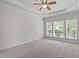 Bedroom with trey ceiling and large window offering an abundance of light at 208 Beckingham Loop, Cary, NC 27519