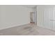Neutral-toned bedroom featuring carpeted flooring and an en suite bathroom, providing a clean and comfortable space at 208 Beckingham Loop, Cary, NC 27519