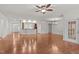 Spacious open-plan living area with hardwood floors and seamless flow to other living spaces at 208 Beckingham Loop, Cary, NC 27519