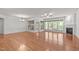 Spacious living room featuring hardwood floors, fireplace, wainscoting and natural light at 208 Beckingham Loop, Cary, NC 27519