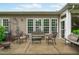 Outdoor patio featuring comfortable wicker furniture, offering a perfect space for relaxing and enjoying the outdoors at 208 Beckingham Loop, Cary, NC 27519