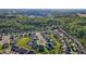 Overhead view captures the close proximity of homes and the quiet, Gathering-friendly neighborhood amidst a forested backdrop at 2096 Dowell Ct, Burlington, NC 27215