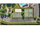 Overhead view showcasing the recreation area complete with a sandy volleyball court, playground, and multiple sports courts at 2096 Dowell Ct, Burlington, NC 27215