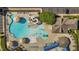 Bird's-eye view of the community pool's splash pad, slides, and wading pool areas, perfect for families with children at 2096 Dowell Ct, Burlington, NC 27215
