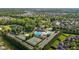 Aerial view showcases a community center, pool, tennis courts and green common areas in the surrounding neighborhood at 2096 Dowell Ct, Burlington, NC 27215