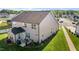 This home features a well-manicured lawn, landscaping, a patio, and outdoor grill at 2096 Dowell Ct, Burlington, NC 27215