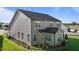 This backyard has lush landscaping, a patio, and a grill at 2096 Dowell Ct, Burlington, NC 27215