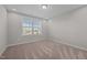 Bedroom with neutral walls, carpeted floors, and a window with blinds at 2096 Dowell Ct, Burlington, NC 27215