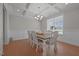 Formal dining room featuring a coffered ceiling, wainscoting, and a stylish chandelier at 2096 Dowell Ct, Burlington, NC 27215