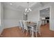 Formal dining room with a coffered ceiling, wainscoting, and hardwood floors at 2096 Dowell Ct, Burlington, NC 27215