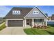 Beautiful two-story home featuring a well-manicured lawn, covered porch, and a two car garage at 2096 Dowell Ct, Burlington, NC 27215