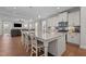 Open-concept kitchen featuring granite countertops, stainless steel appliances, and a large island with seating at 2096 Dowell Ct, Burlington, NC 27215