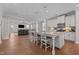 Open kitchen with granite countertops, island with seating, stainless appliances and open living space at 2096 Dowell Ct, Burlington, NC 27215