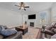 Inviting living room with fireplace, ceiling fan, and ample seating, creating a cozy atmosphere at 2096 Dowell Ct, Burlington, NC 27215