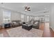 Comfortable living room featuring plush seating, ceiling fan, and an open layout to the kitchen at 2096 Dowell Ct, Burlington, NC 27215