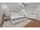 Spacious main bedroom with tray ceiling, wood floors, and ensuite access at 2096 Dowell Ct, Burlington, NC 27215