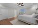 Main bedroom featuring a tray ceiling, carpet, and an ensuite bathroom at 2096 Dowell Ct, Burlington, NC 27215