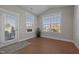 Sunroom with lots of natural light, door to outdoors, and wood flooring at 2096 Dowell Ct, Burlington, NC 27215