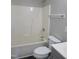 Clean bathroom with white shower tub and gray vanity at 2121 Lime St, Durham, NC 27704