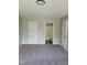 Neutral bedroom with carpet, two closets, and attached bath at 2121 Lime St, Durham, NC 27704