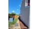 Siding exterior featuring a small garden and an air conditioning unit at 2121 Lime St, Durham, NC 27704
