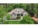 Stunning aerial view of a beautiful home surrounded by lush green trees at 216 Colonial Ridge Dr, Pittsboro, NC 27312