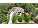Gorgeous aerial view showcases a home nestled in a beautiful wooded lot at 216 Colonial Ridge Dr, Pittsboro, NC 27312