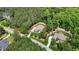 Birds-eye view of a house and neighboring property highlighting the wooded residential area at 216 Colonial Ridge Dr, Pittsboro, NC 27312