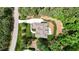 Aerial shot of the home in a wooded setting with the street and driveways visible at 216 Colonial Ridge Dr, Pittsboro, NC 27312