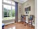 Charming bar area features hardwood floors, natural light, and ample seating at 216 Colonial Ridge Dr, Pittsboro, NC 27312