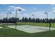 Community basketball court with multiple hoops and well-maintained landscaping at 216 Colonial Ridge Dr, Pittsboro, NC 27312