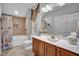 Nautical themed bathroom with a vanity, sink, and shower-tub combo, perfect for relaxation at 216 Colonial Ridge Dr, Pittsboro, NC 27312