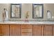 Bathroom vanity with double sinks, granite countertops, and decorative mirrors, adding style and functionality at 216 Colonial Ridge Dr, Pittsboro, NC 27312
