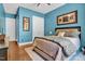 Inviting bedroom featuring neutral decor, plush bedding, and ample natural light at 216 Colonial Ridge Dr, Pittsboro, NC 27312