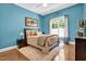 Comfortable bedroom with a large window, cozy rug, and stylish furnishings at 216 Colonial Ridge Dr, Pittsboro, NC 27312