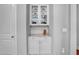 Built-in cabinet with glass doors and granite countertop offers elegant storage solutions at 216 Colonial Ridge Dr, Pittsboro, NC 27312