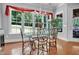 Bright breakfast nook with large windows and views of the backyard at 216 Colonial Ridge Dr, Pittsboro, NC 27312