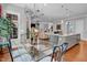 Dining Area with glass top table, view to living room, and natural light at 216 Colonial Ridge Dr, Pittsboro, NC 27312