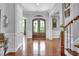Elegant foyer boasts rich hardwood floors and a striking double door entry at 216 Colonial Ridge Dr, Pittsboro, NC 27312