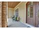 Inviting front porch with comfortable seating, perfect for relaxing and enjoying the outdoors at 216 Colonial Ridge Dr, Pittsboro, NC 27312