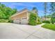 Spacious three-car garage with ample parking and well-manicured landscaping at 216 Colonial Ridge Dr, Pittsboro, NC 27312