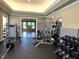 Bright gym featuring weight training equipment, free weights and padded mats at 216 Colonial Ridge Dr, Pittsboro, NC 27312