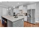 Open concept kitchen with stainless steel appliances, granite countertops, and ample storage at 216 Colonial Ridge Dr, Pittsboro, NC 27312